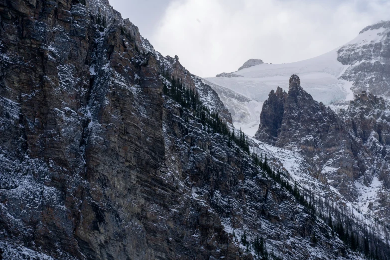 snow and mountain tops against the dark grey clouds