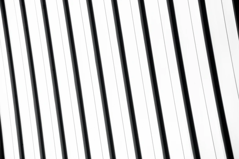 black and white vertical striped pattern wallpaper in a room