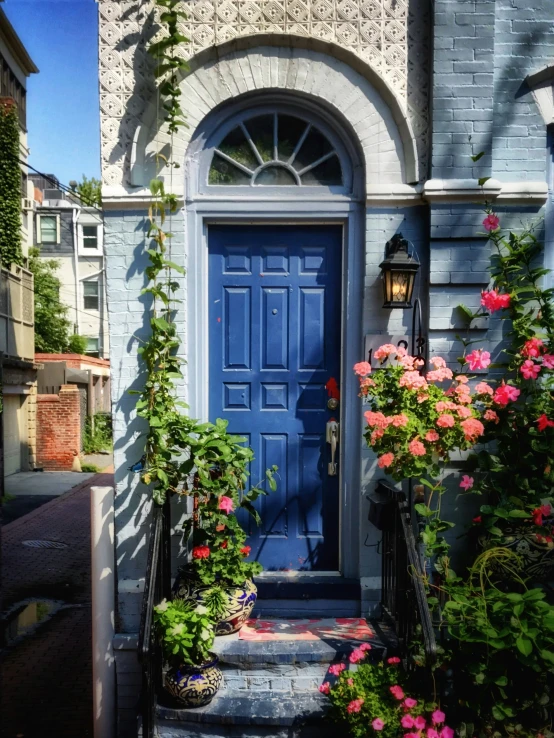 front door and step leading to an upper story house