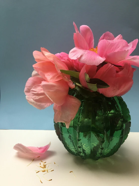 a glass vase with a bunch of pink flowers