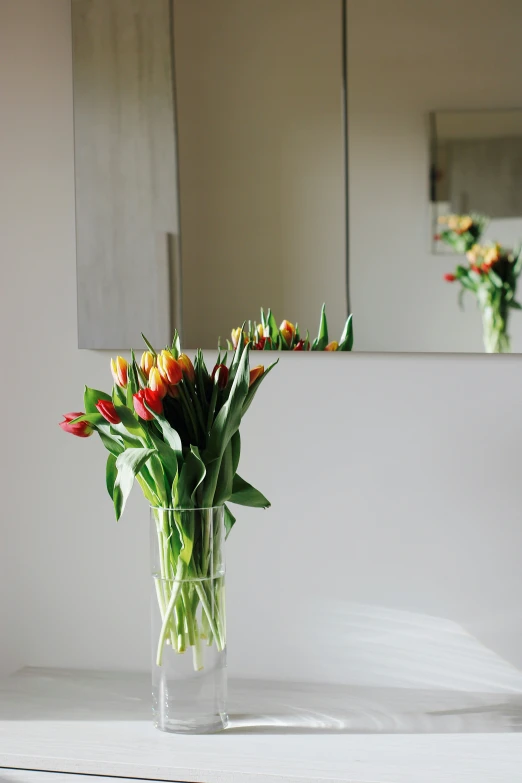 a bunch of colorful flowers is placed in a vase