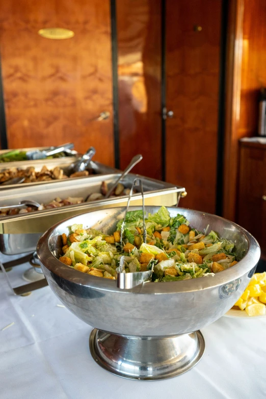 a buffet with several different foods in a bowl
