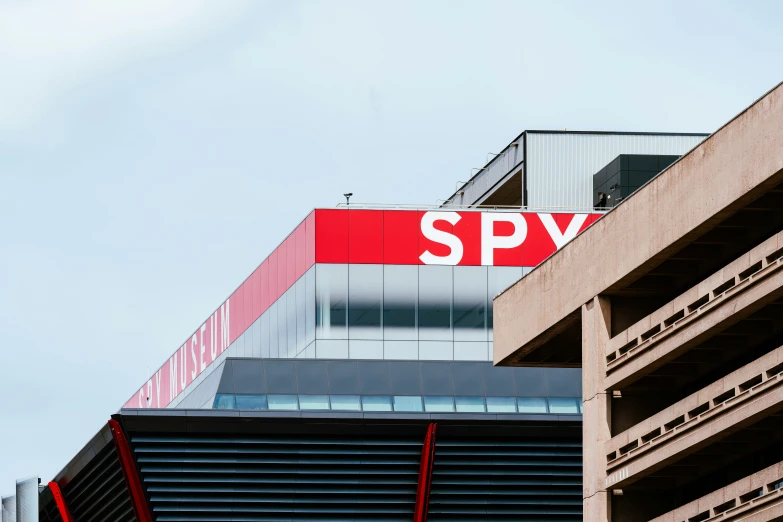 a large sign on top of the building says spy