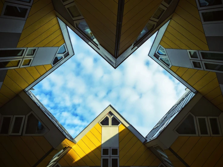 a picture from below looking up at an office building