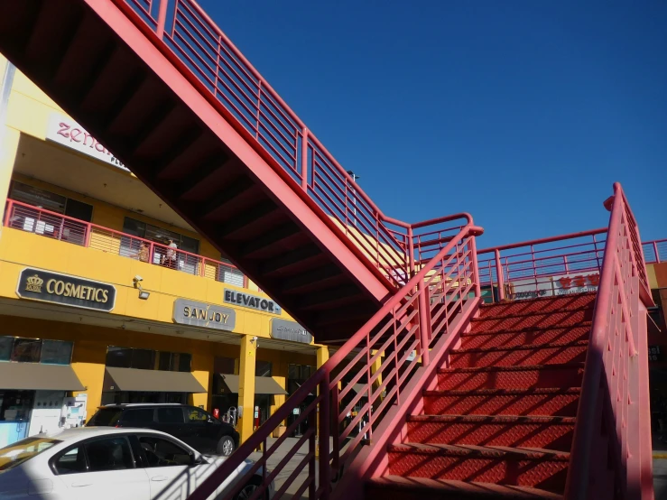 a car is parked next to a set of stairs