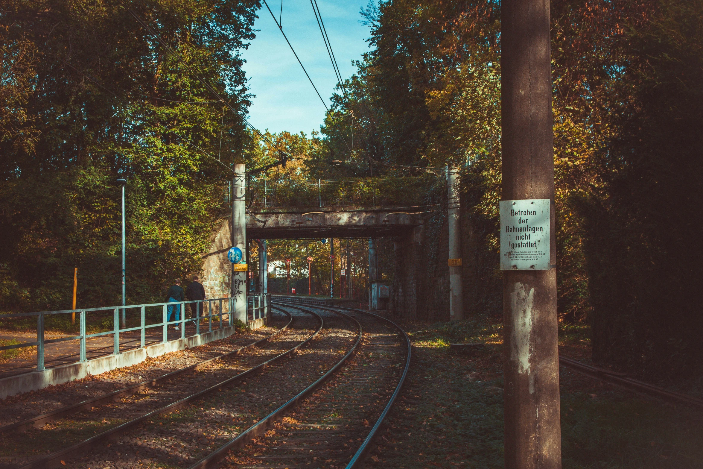 a train track with rails leading into a tunnel