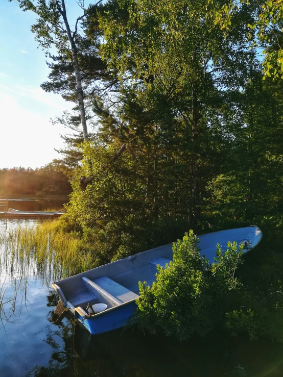 a row boat sitting on top of a lake