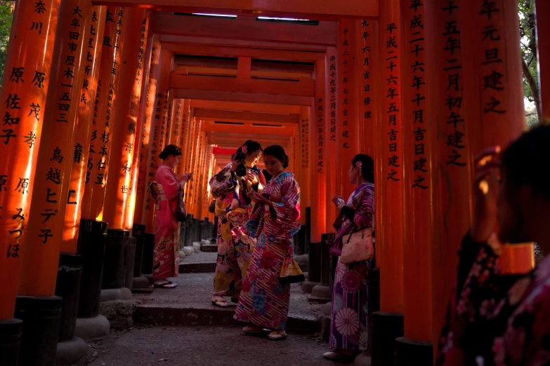 the woman are standing in line at the end of the walkway