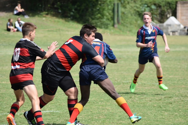 group of people playing a game of rugby