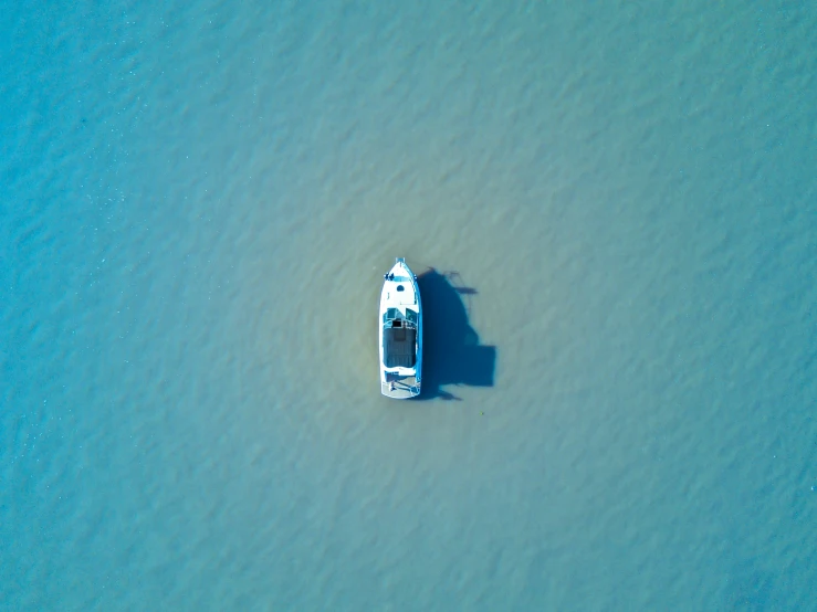 an aerial view of an aerial view of a boat in the water