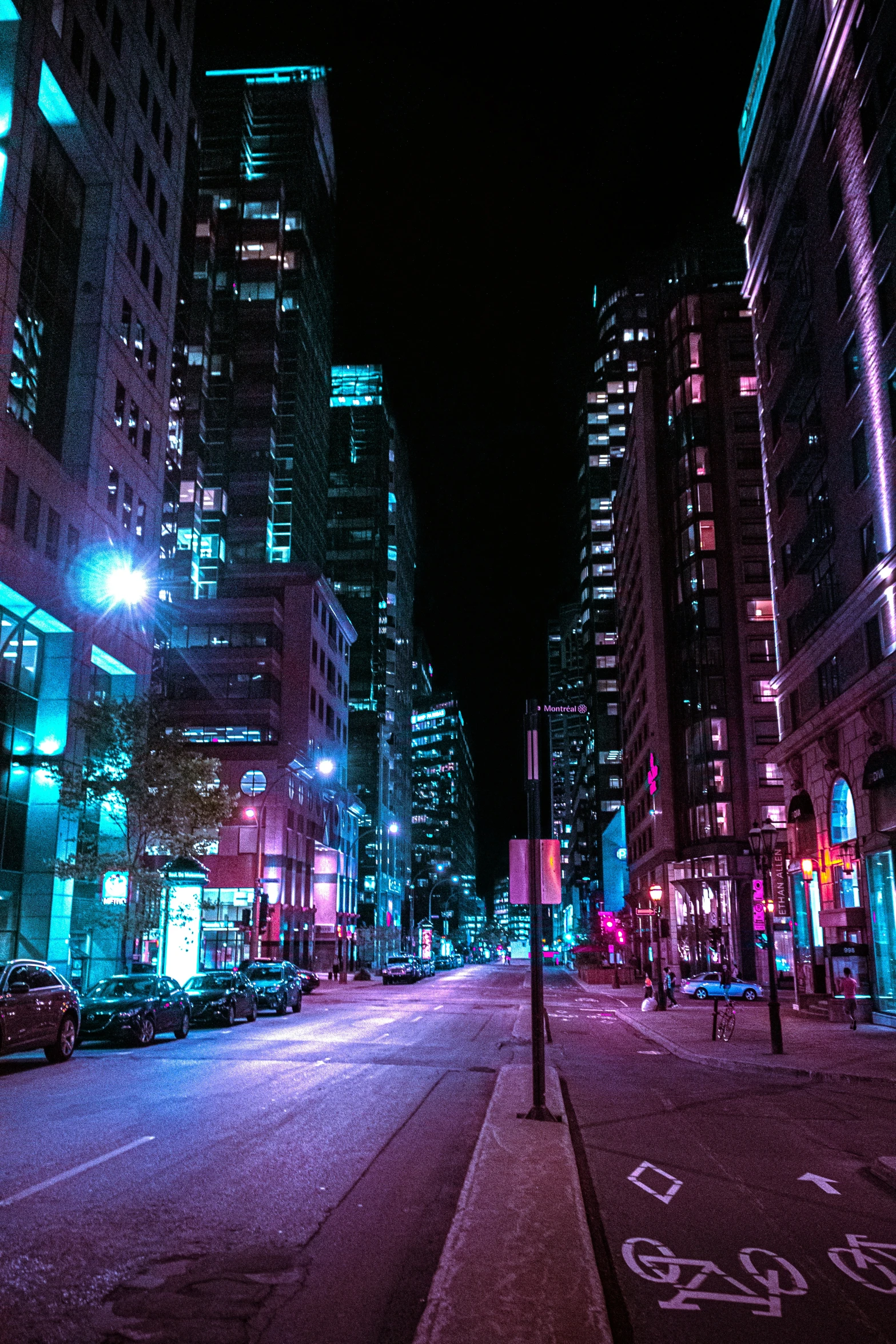 an empty street is lit up with bright lights