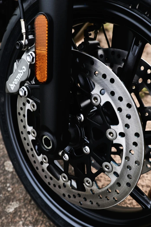 closeup of disc kes on the front of a black motorcycle