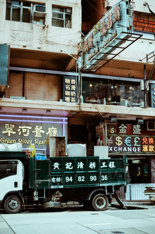 an oriental restaurant with the truck out front