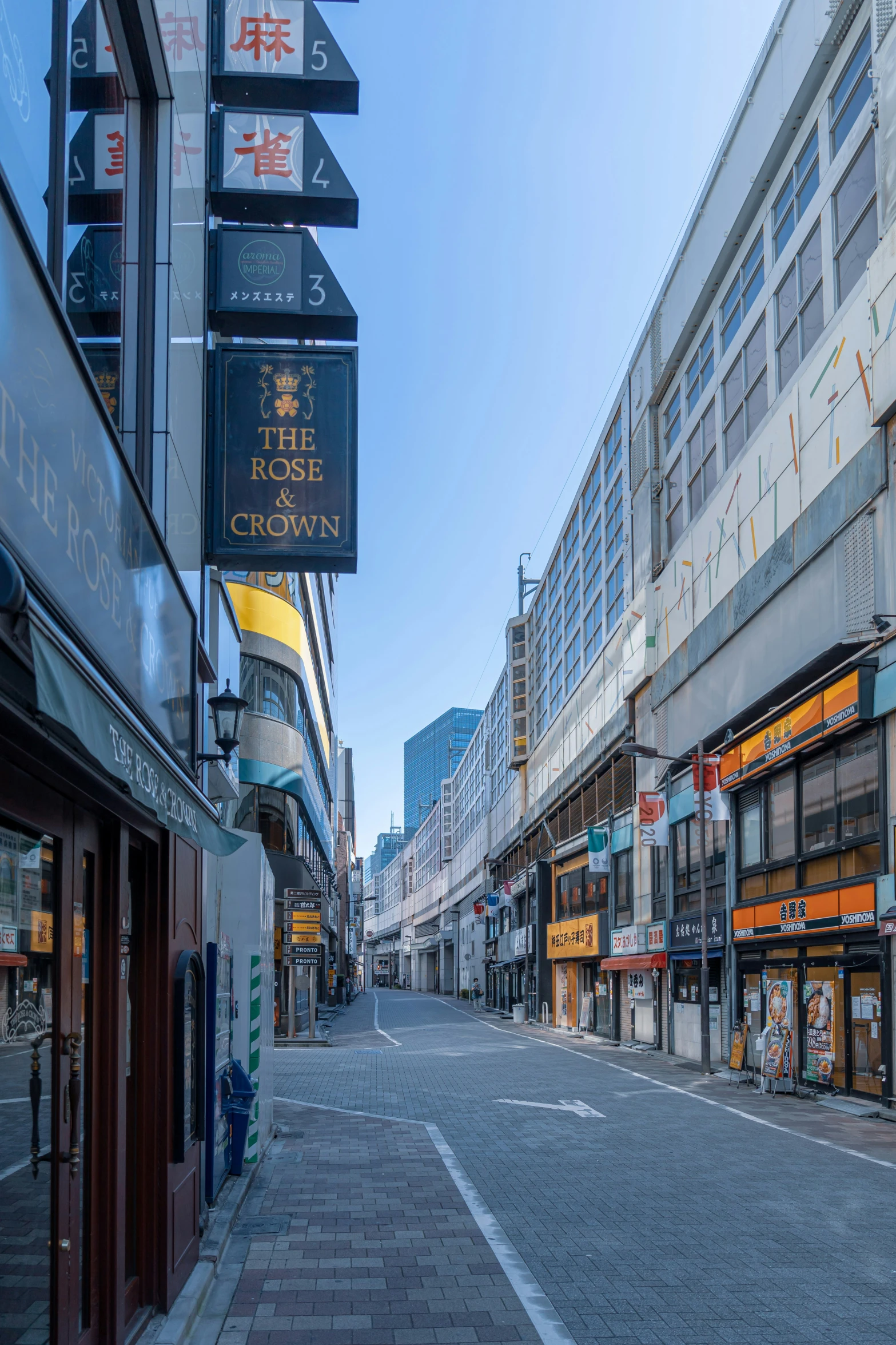 shops lining a street in the city are open