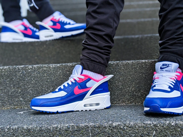 the feet of a person in sneakers on stairs