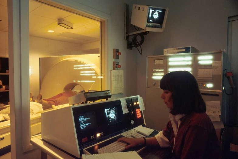 an employee works on the computer in a room