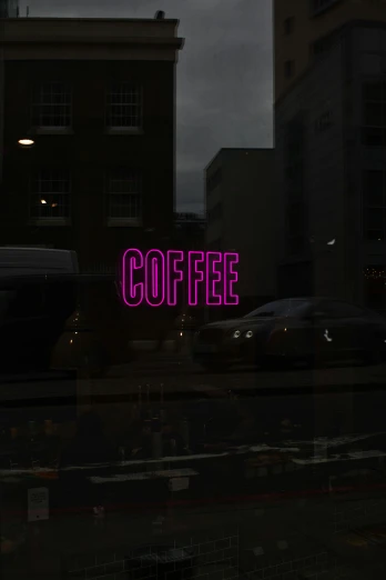 the word coffee on top of a glass door