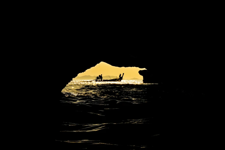 two people are out in the water on a surfboard