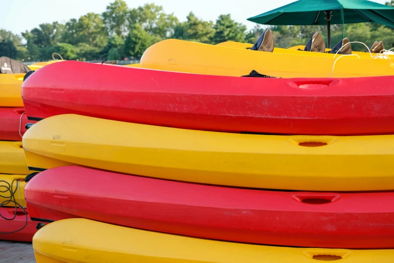 several colorful boats are lined up near one another