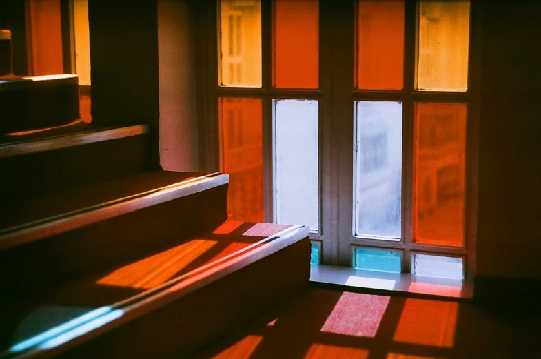 an upclose po of sunlight in the window from the staircase