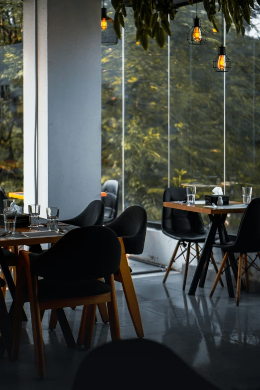 tables, chairs, and chairs are arranged around a table in a restaurant