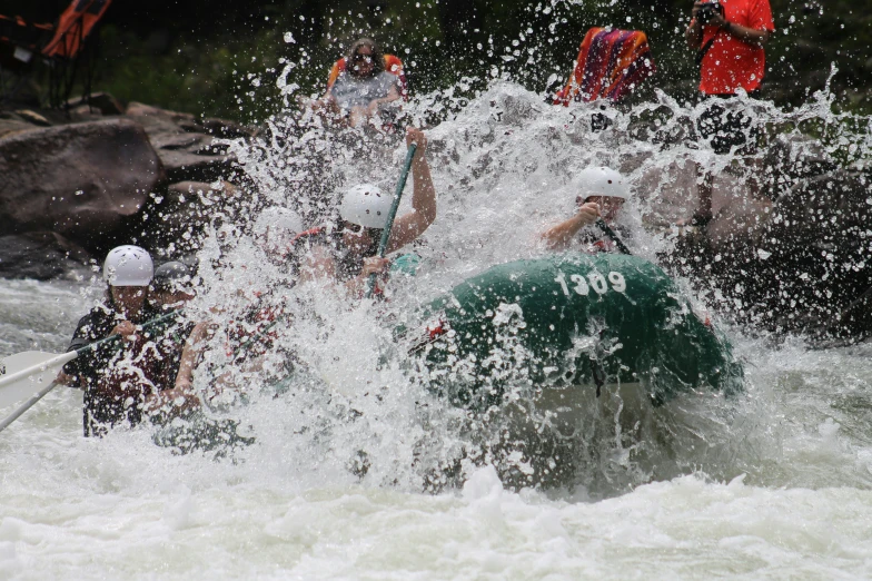 many people are in a raft in the water