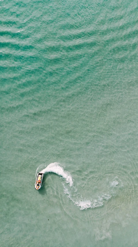 two boats in the water as seen from above