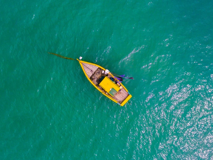 a boat that has people in it floating on the water