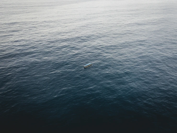 two people on a boat on the ocean