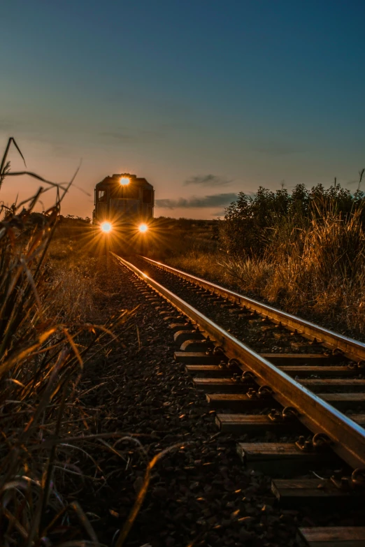 a train is traveling down the railroad tracks