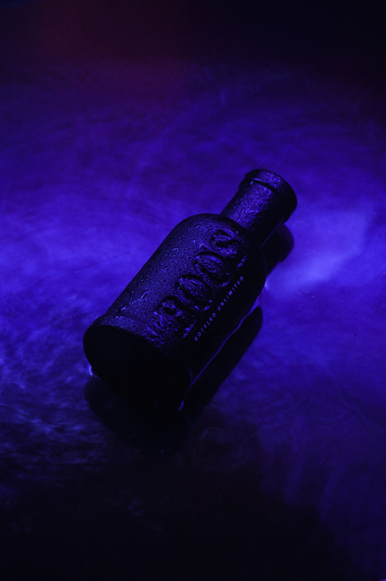 an empty cell phone sitting on the floor in a blue room