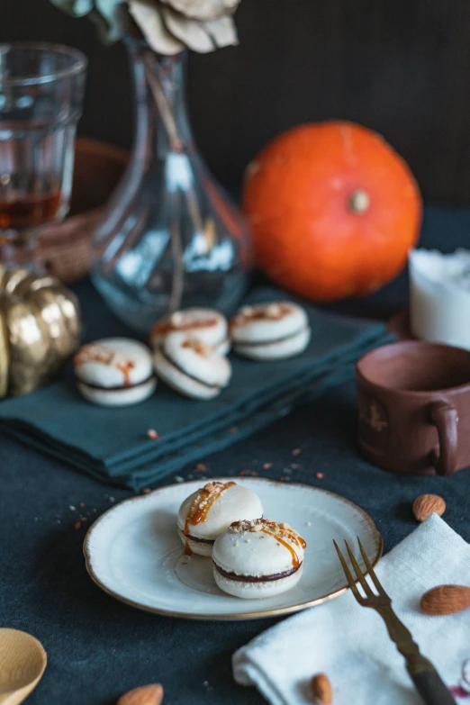 desserts with small white plates and forks set on a dark table