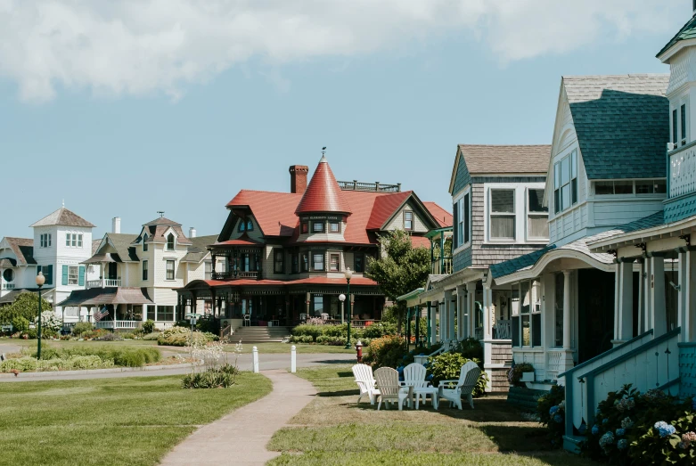 row of victorian houses with colorful painted roofing