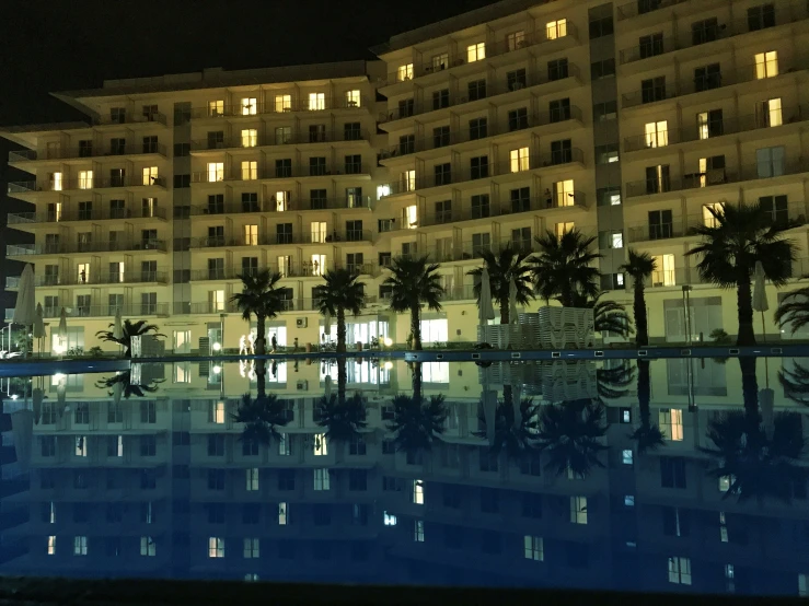 a el building reflecting in the swimming pool