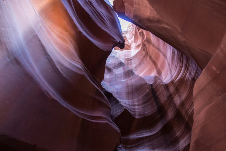 a narrow canyon with water coming out from it