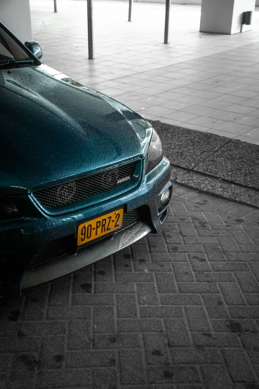 the rear end of a car parked in a parking lot