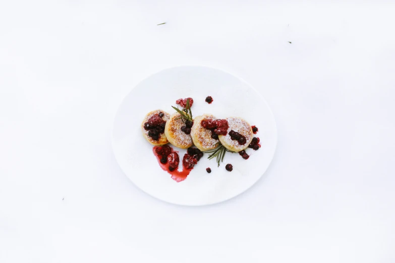 a small plate filled with raspberry and strawberry shortbreads