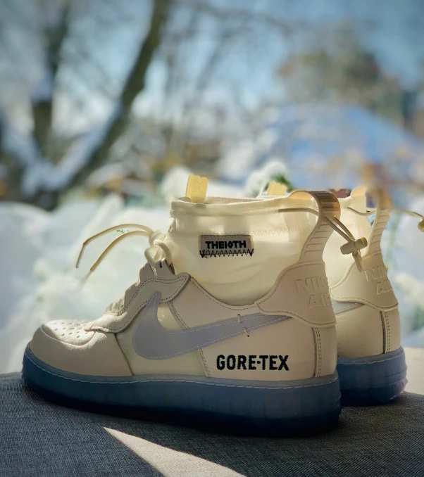 a pair of sneakers sits on top of the snow