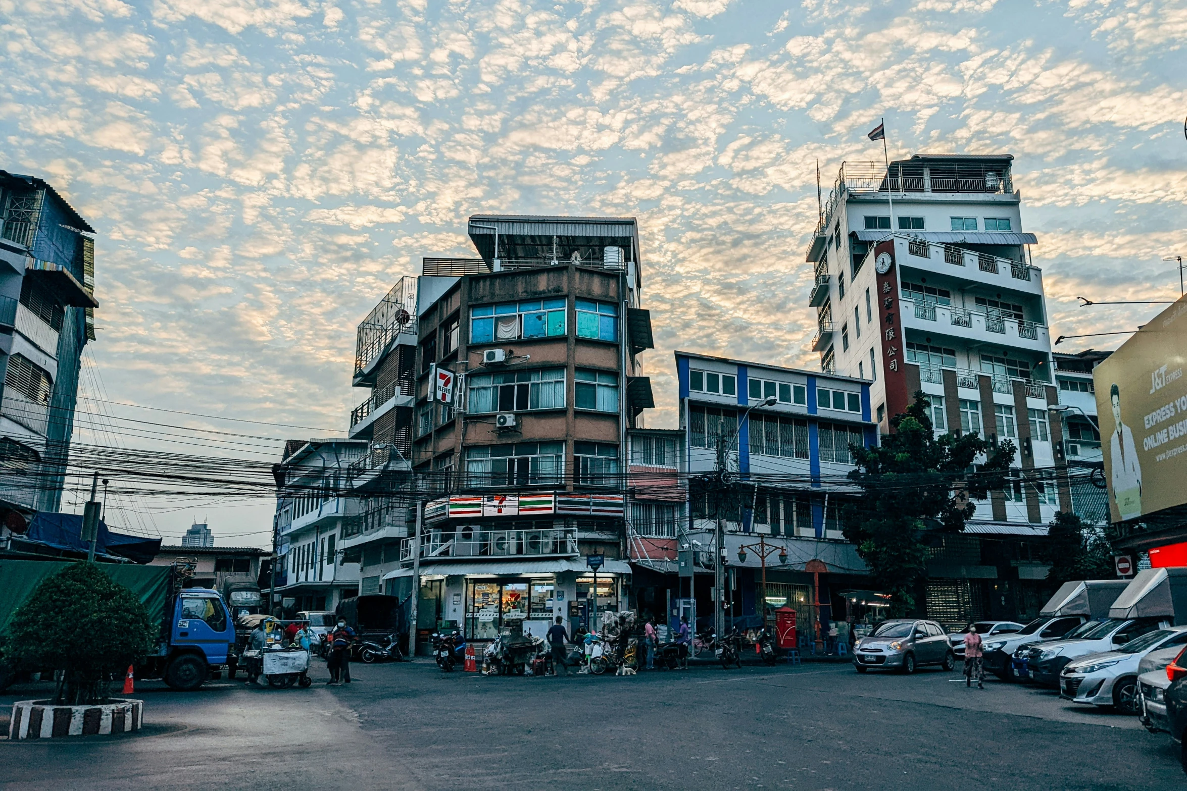 a group of buildings next to the road