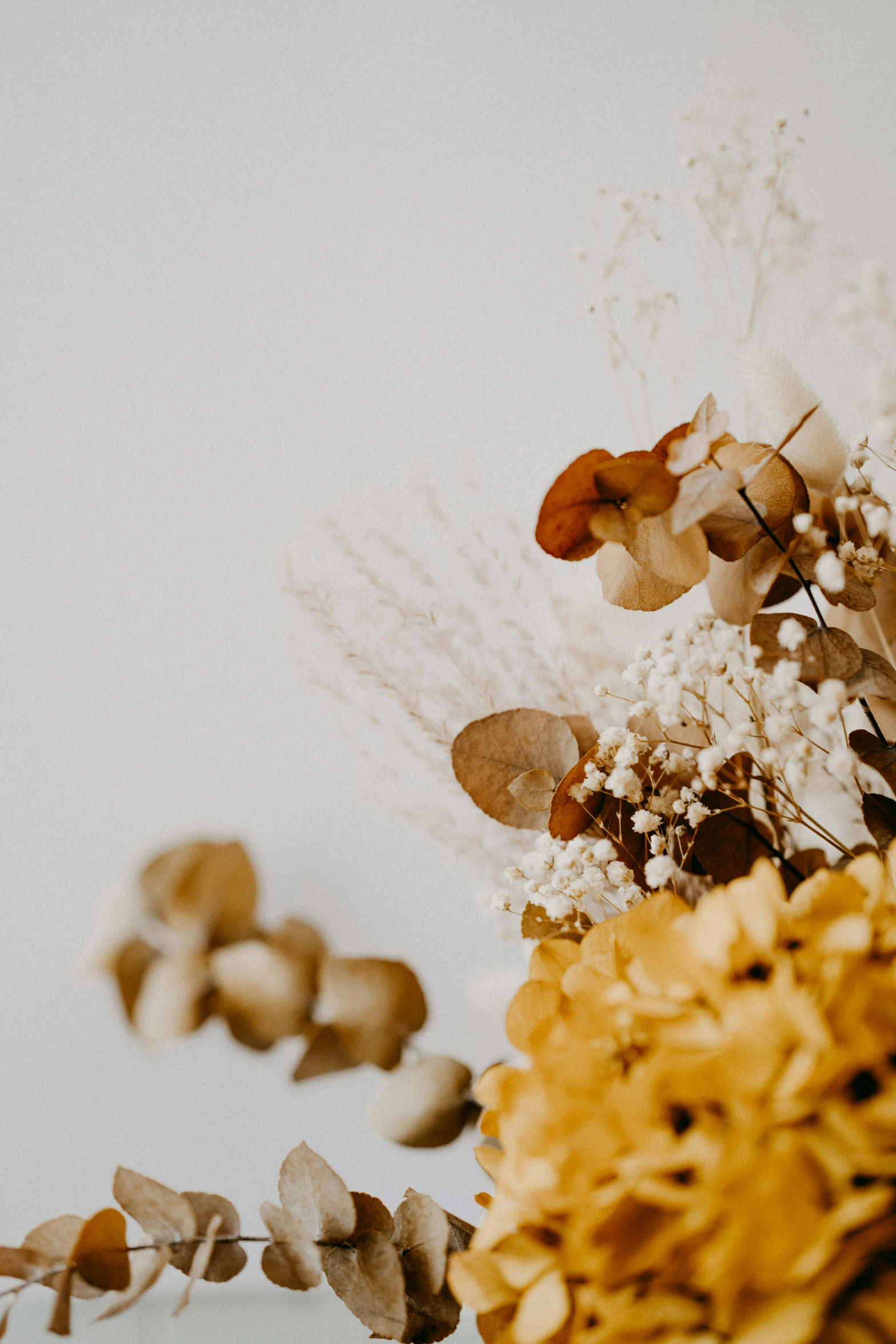 a bouquet of flowers next to a large object of flowers