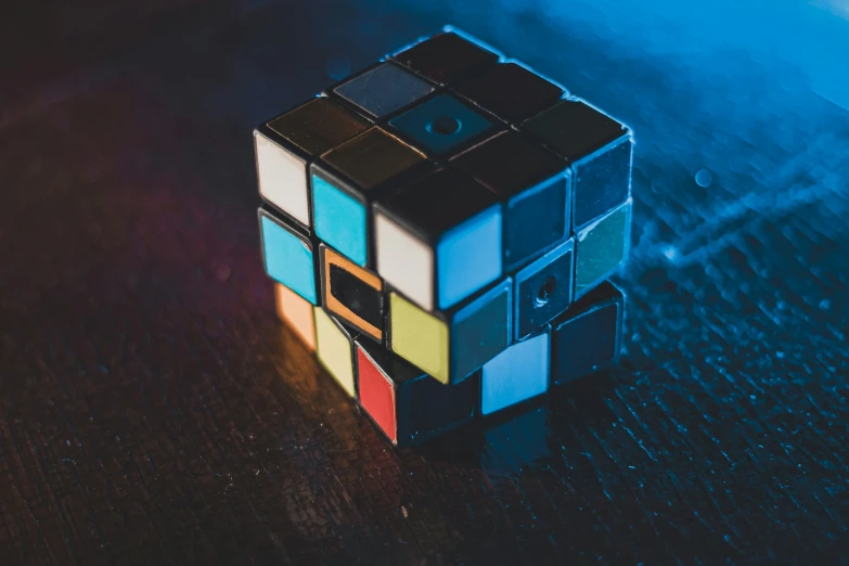 a small colored rubik puzzle sitting on a table