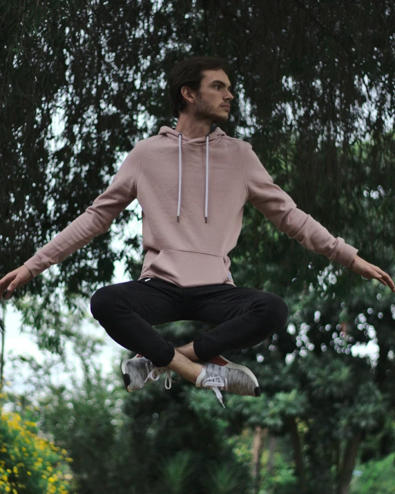 a man flying through the air while riding a skateboard