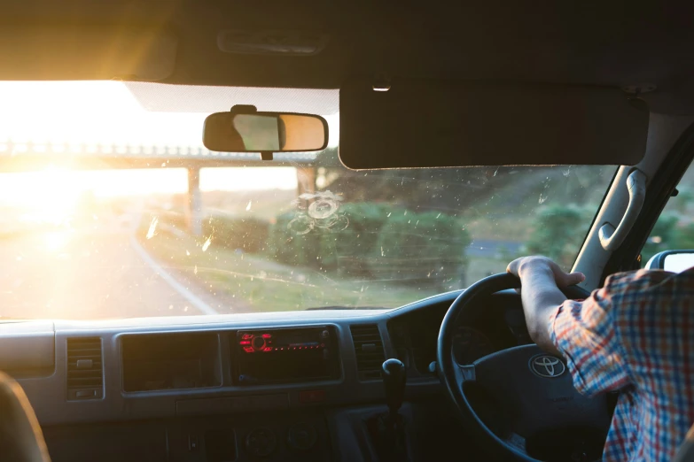 the view from the inside of the vehicle with the sun glaring