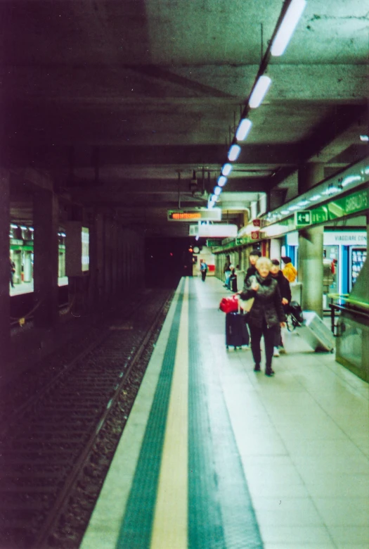 the trains are parked at the train station