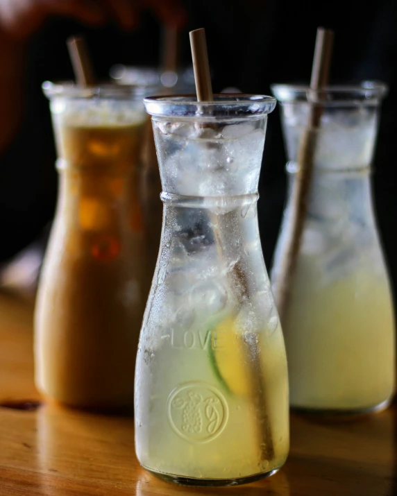 a close up of three drinks near one another