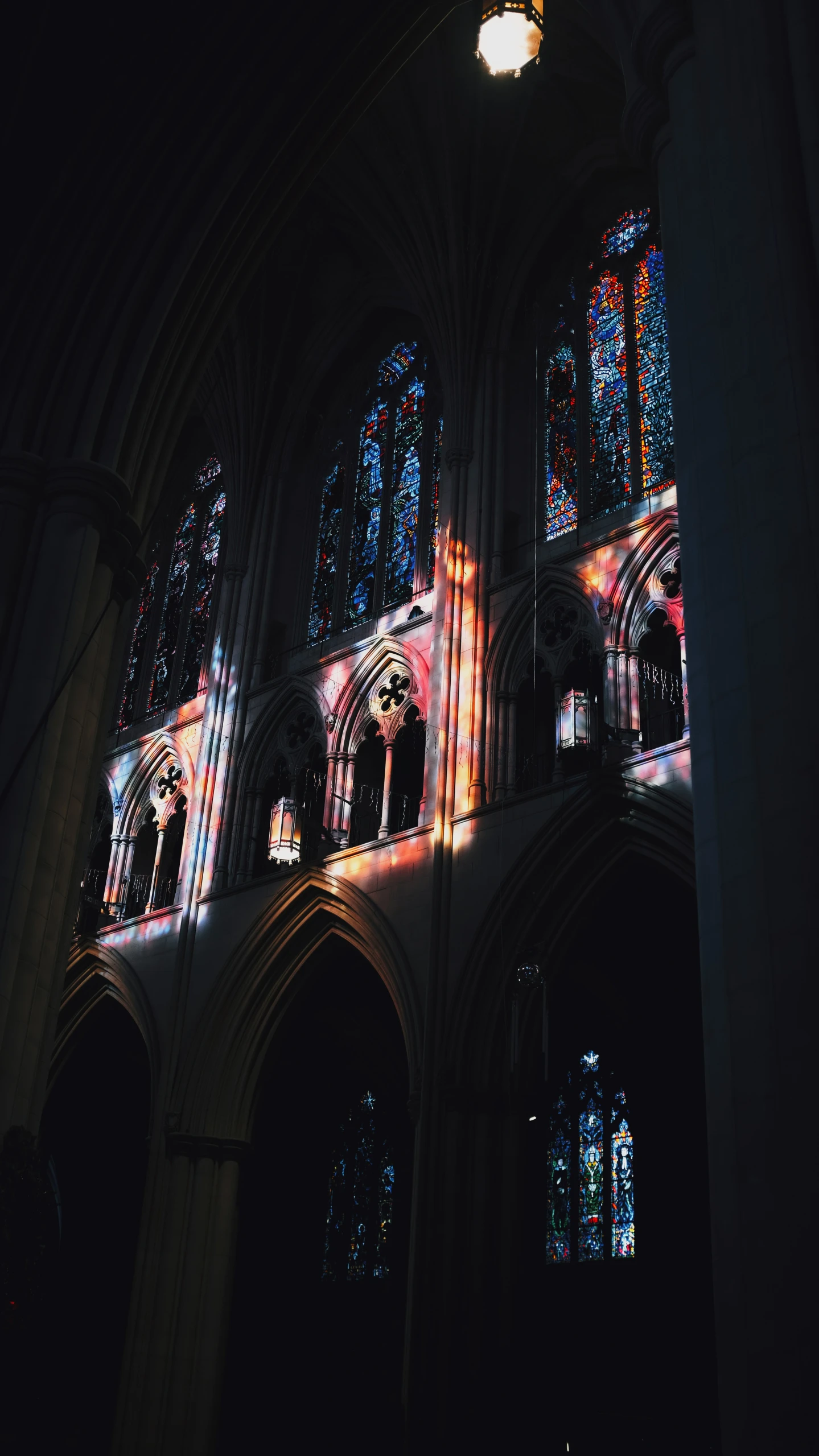 a picture of an old church lit up at night