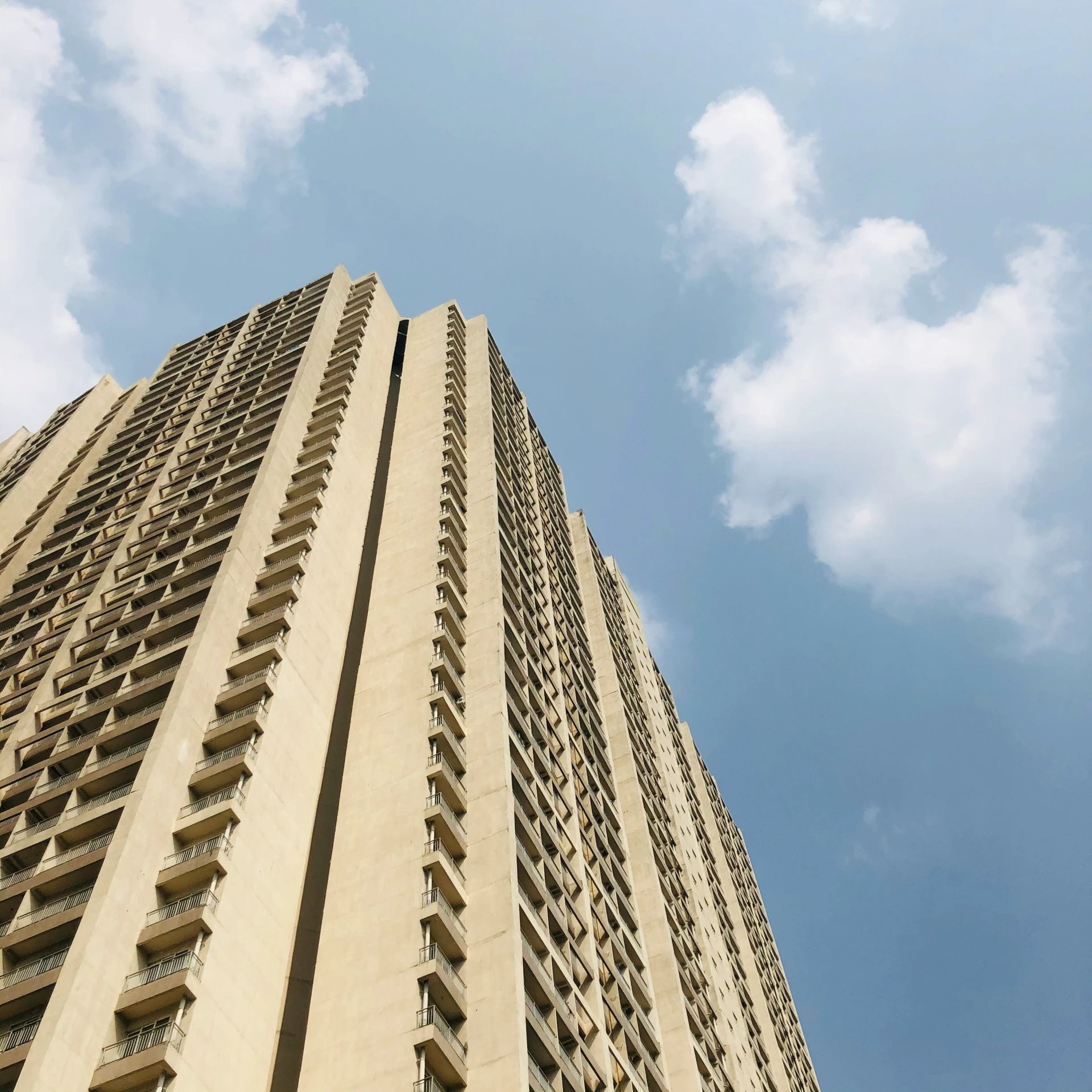 a large building sitting in the middle of the day