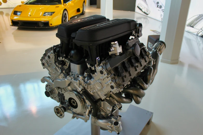 a vehicle engine is on display on a stand