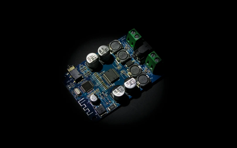 an electronics board on a dark background