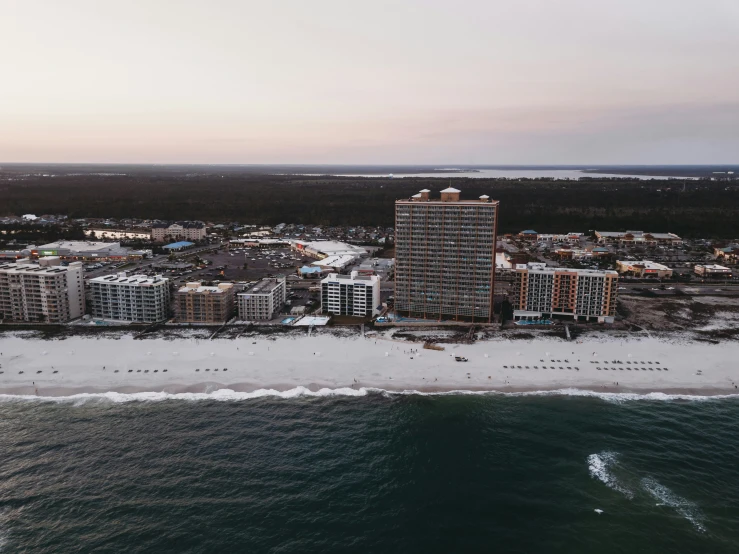 a bird's eye view of an ocean side city from the sky